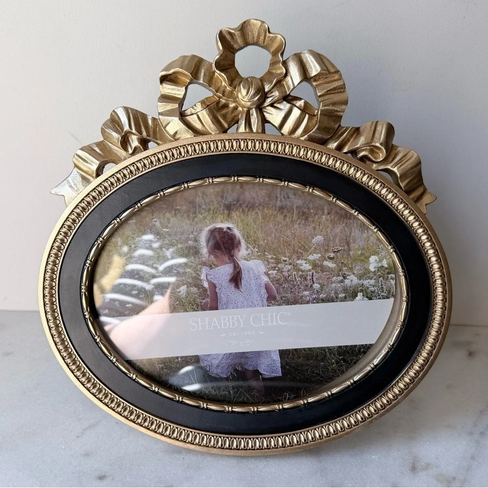 Ornate Oval Gold Photo Frame with Black Trim bow on top 7”x5”